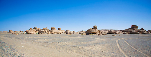 Tranquil  white sand desert with sandstones and clear blue sky ,Scenery in Tibet .