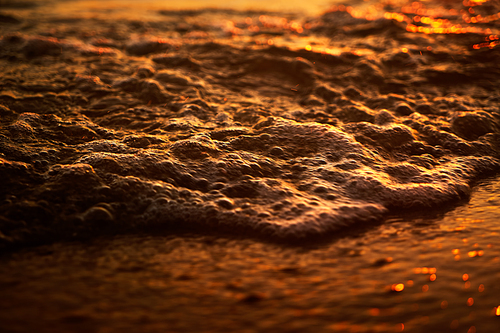 Abstract golden dawn over the motion blur speed beach .Rawa island , Malaysia . Selected focus on center .