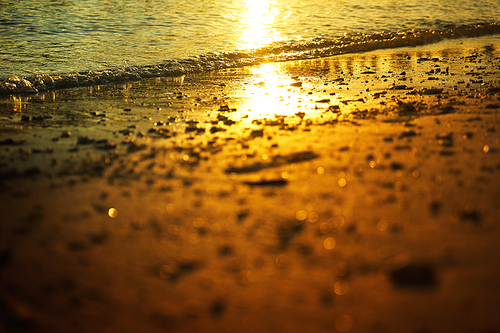 Golden dawn over the beach .Rawa island , Malaysia . Selected focus on center .