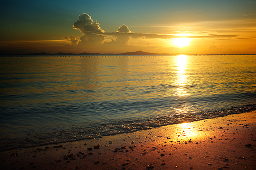Golden dawn over the beach .Rawa island , Malaysia . Selected focus on center .
