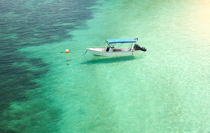 Boats on beautiful tropical beach in  Rawa island. White sandy beach . Malaysia .