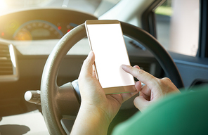 Man driver using smart phone in car during traffic jam , blank white screen for design purpose .