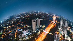 Wide and fisheye view of night Kuala Lumpur cityscape skyline .