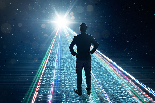 Rear view of businessman standing on binary code numbers on motion lighting road , speed and faster digital matrix business technology information concept .