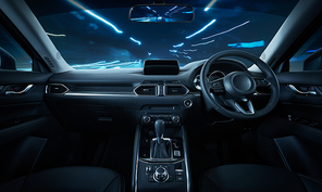 Modern black car dashboard interior with moving motion blur street background, luxury car interior concept .