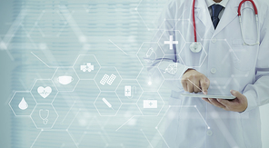 Doctor using a digital tablet with healthcare medical icon, medical information and technology data network concept