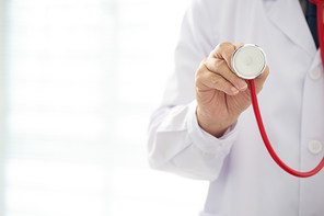 Unknown doctor doctor working. man doctor concept in hospital. Doctor with red color stethoscope.