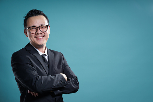 Portrait of confident asian businessman smiling