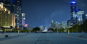 Panoramic view of empty urban floor with city skyline. Night scene