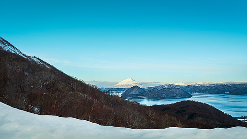 Panorama view of Showa Shinzan from mountain Usuzan in Lake Toya, Hokkaido, Japan during winter for breath-taking scenery