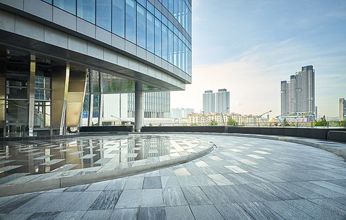 Modern building exterior with cityscape background