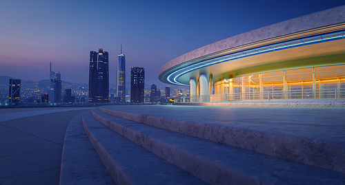 A towering building stands in the city center, adorned with hundreds of bright lights that illuminate the night sky. 3D rendering