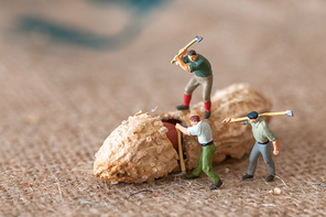 Toy figures of lumbermen with a peanut