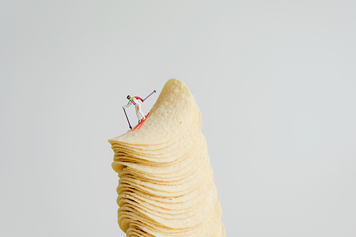 Skier skiing down from stack of potato chips