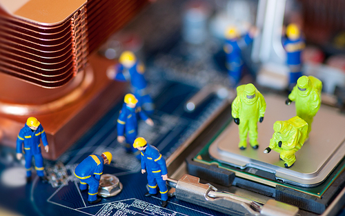Group of construction workers repairing motherboard