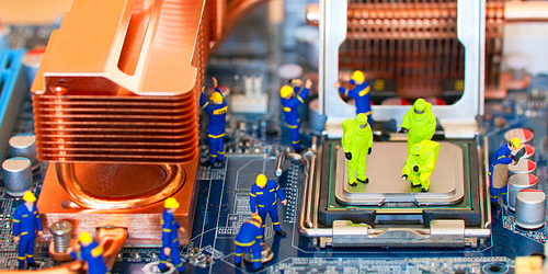 Team of construction workers repairing computer