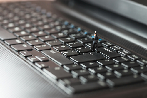 Policemen inspecting laptop. Computer security concept