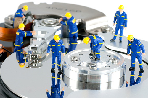 Group of workers repairing HDD. Hard Drive repair concept