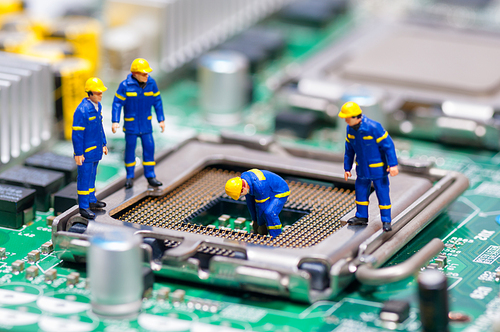 Group of construction workers repairing CPU. Technology concept
