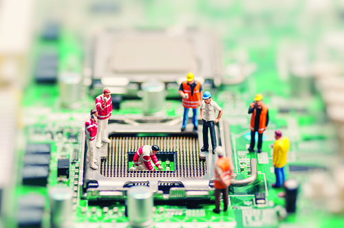 Little workers repairing motherboard. Technology concept