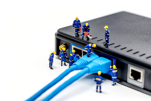 Team of technicians connecting network cable. Macro photo