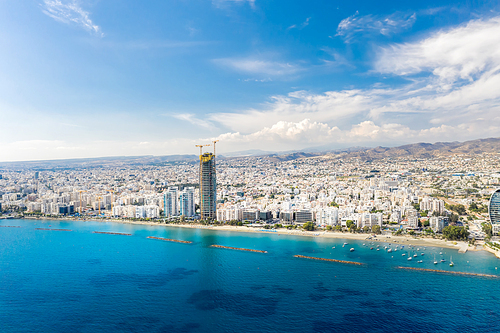 Aerial view on Limassol cityscape with blue sky and seascape