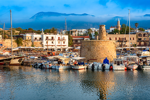 Scenic view of Kyrenia (Girne) harbour with mountains on background. Cyprus.