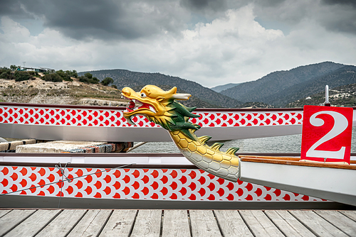 Moored dragon boats on the river jetty