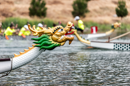 Dragon boats racing. Decorated head of the boat.