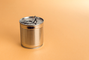 Close-up of man opening a tin can