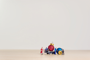 Toy truck carrying Christmas decorative balls. Christmas concept with copy space.