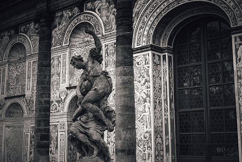 Alegory of night - baroque sculpture at in front of Real tennis room. Royal Garden of Prague Castle, Czech Republic