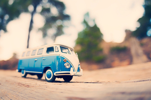 Miniature travelling vintage van. Color tone tuned macro photo