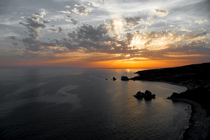Sunset seascape near Aphrodite's Rock. Paphos District, Cyprus