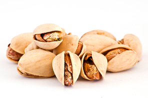 Salty nuts of roasted pistachio on isolated background