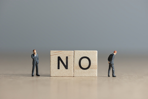 Wooden tiles with letters spelling out the word No. Business concept.