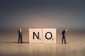 Wooden tiles with letters spelling out the word No. Business concept.