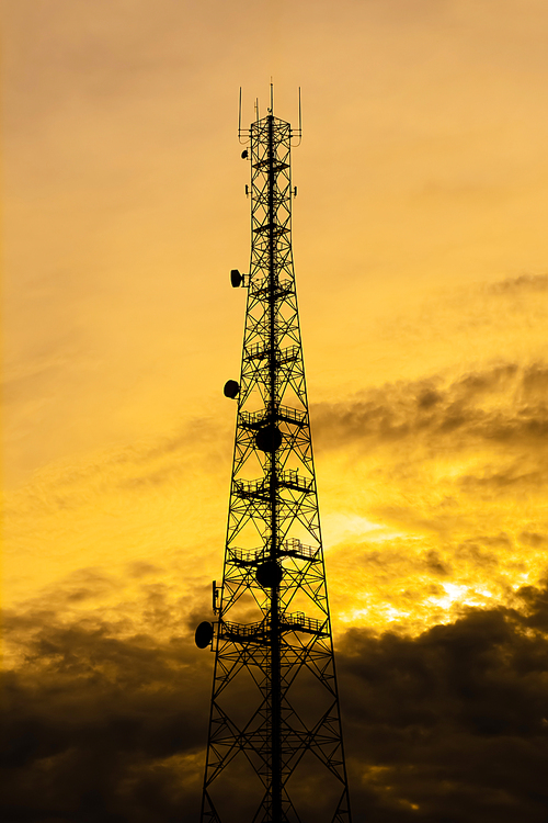 Telecom tower silhouette  in twilight sky background