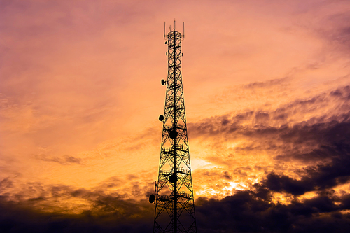 Telecom tower silhouette  in twilight sky background