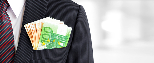 Money, Euro currency (EUR) banknotes, in businessman suit pocket - business and financial panoramic (header) background concept