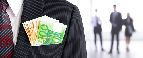 Money, Euro currency (EUR) banknotes, in businessman suit pocket on blur businesspeople background - business and financial panoramic (header) background concept