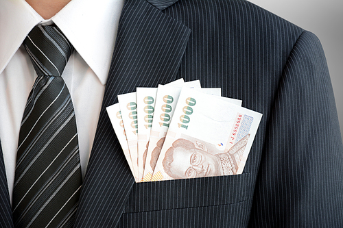 Money, Thai Baht (THB), in businessman suit pocket