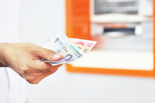 Hand holding money - Chinese renminbi yuan banknotes