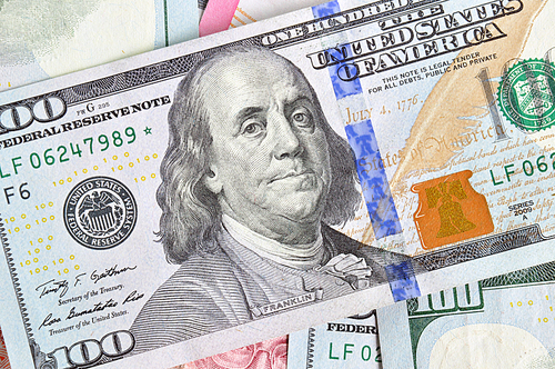 Money - 100 United States dollars (USD) bills - focusing on Benjamin Franklin face
