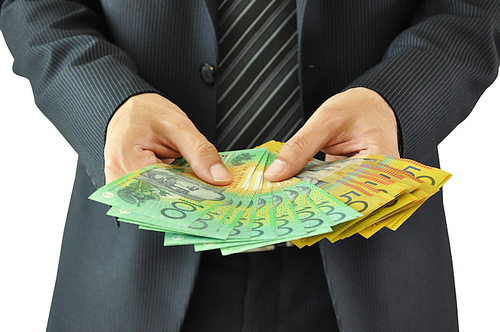 Businessman hands holding money  - Australian dollar bills