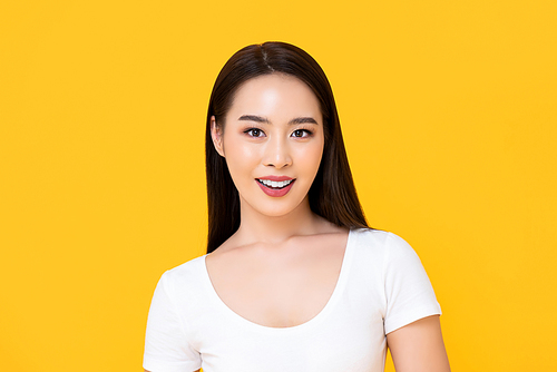 Happy smiling long hair beautiful Asian woman  isolated on yellow background