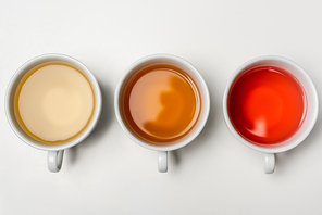Top view of cups of tea on white background