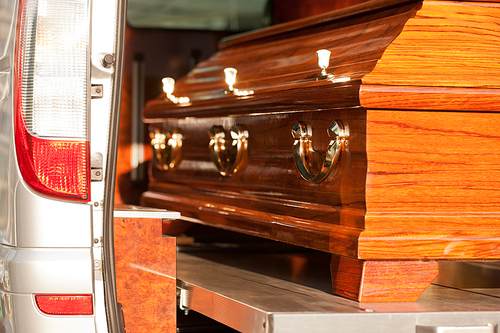 Dolor - Funeral with coffin on a cemetery in hearse