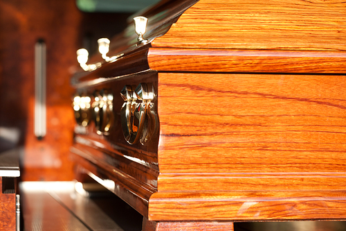 Dolor - Funeral with coffin on a cemetery in hearse