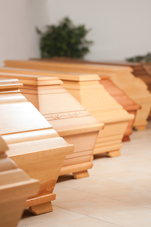 Coffins are presented in shop of undertaker